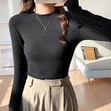 Women Wear A Long-Sleeved White T-Shirt With A Half-High Collar To Show A Thin Blouse In Autumn And