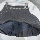 Solid Pleated Mini Skirt With Butterfly Chain- Outfit