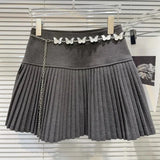 Solid Pleated Mini Skirt With Butterfly Chain- Outfit