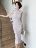 Zingj Woman In A Sleeveless Knitted Dress Is Slim And Slim In