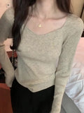 Woman's Clavicle Sweater Shows A Slim And Leaky Collarbone With A Square Collar In The Autumn And