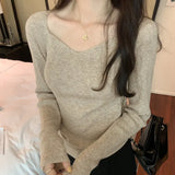Woman's Clavicle Sweater Shows A Slim And Leaky Collarbone With A Square Collar In The Autumn And